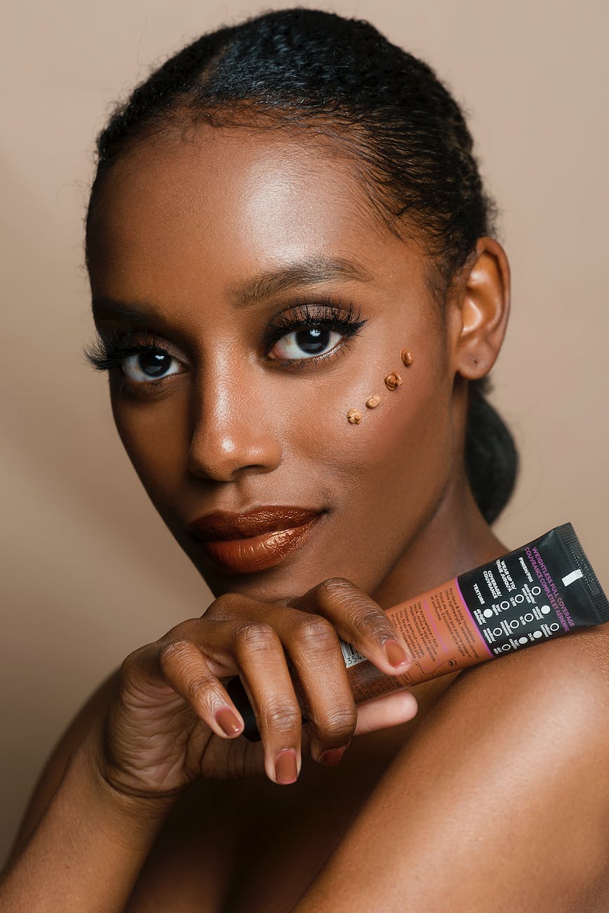 woman holding brown and black soft tube